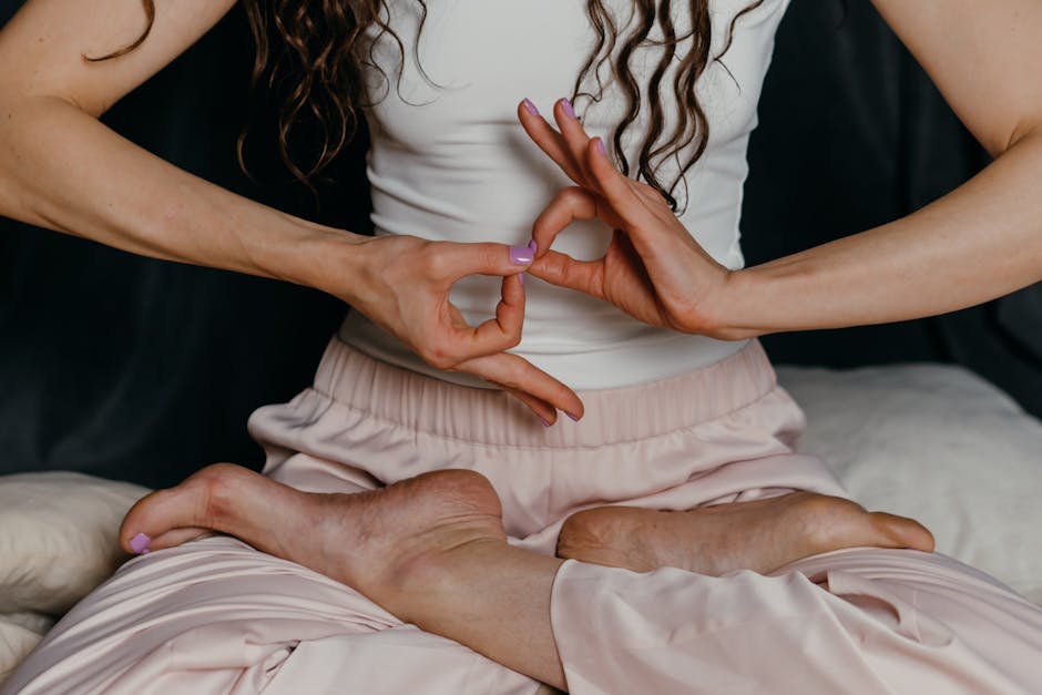 Close-up of a person's hands in a graceful yoga mudra position